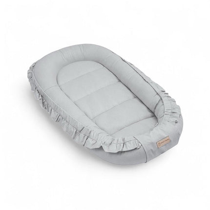 Babynestchen Baumwolle Rüschen – Verspielter mitwachsender Baby-Kokon