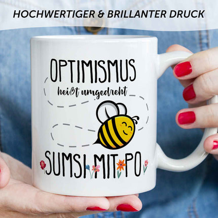 SEO. Bedruckte Tasse mit Spruch - Optimismus heißt umgedreht Sumsi mit Po - Weiß Linkreich
