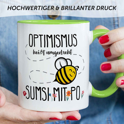 SEO. Bedruckte Tasse mit Spruch - Optimismus heißt umgedreht Sumsi mit Po - Grün Linkreich