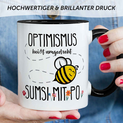 SEO. Bedruckte Tasse mit Spruch - Optimismus heißt umgedreht Sumsi mit Po - Schwarz & Weiß Linkreich