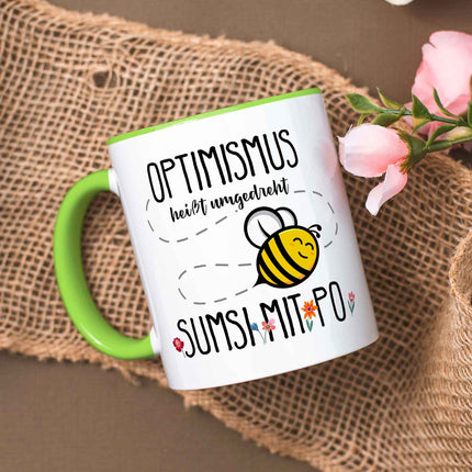 SEO. Bedruckte Tasse mit Spruch - Optimismus heißt umgedreht Sumsi mit Po - Grün Linkreich